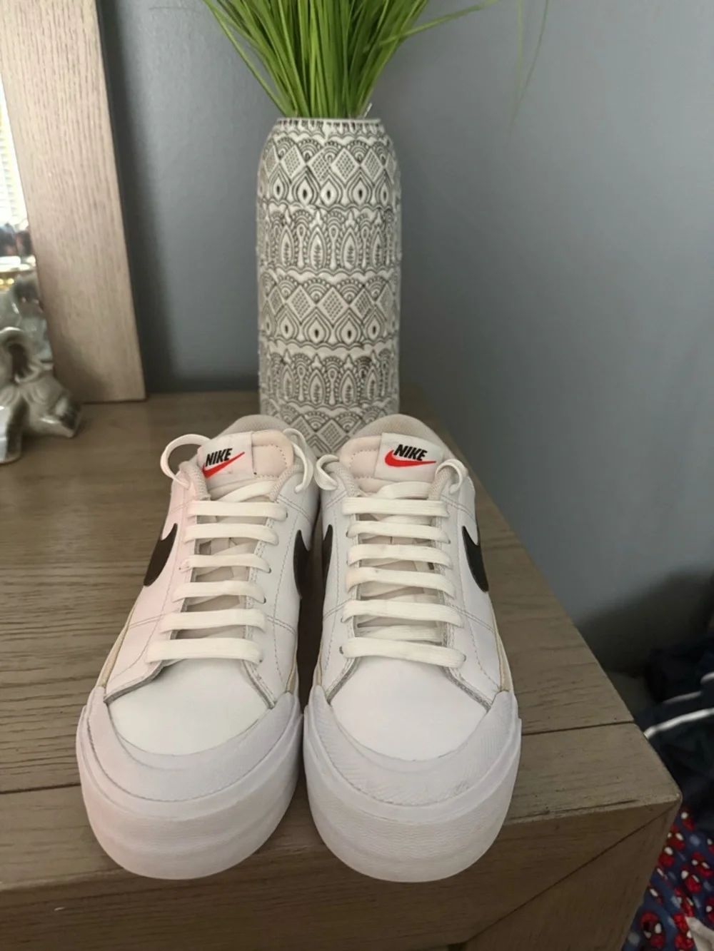 Nike White Low-Top Sneakers with Black Swoosh and Gold Accent - Picture 3 of 3